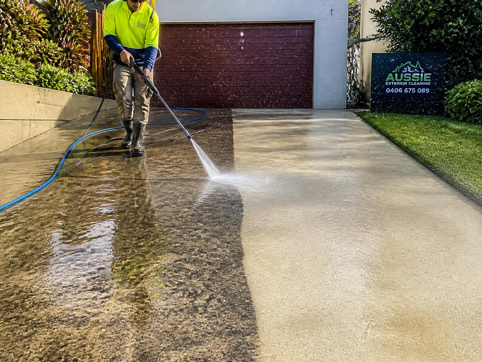 Pressure washing a concrete driveway